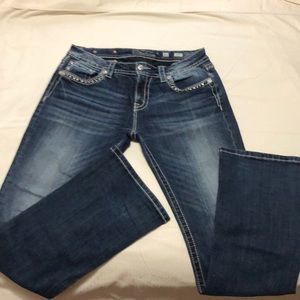 Miss Me Women’s mid rise, boot cut denim jean.